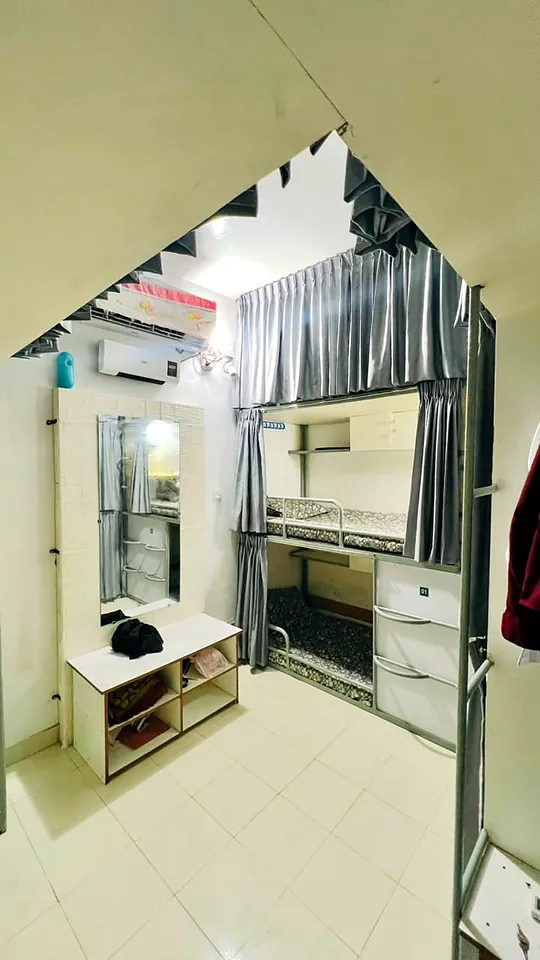 AC bunk room with mirror and dressing corner